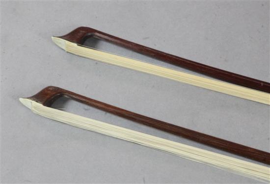 Two violin bows, one silver and the other gold mounted, unstamped,